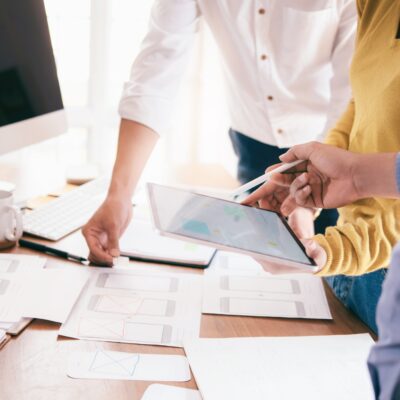 Three people at desk working