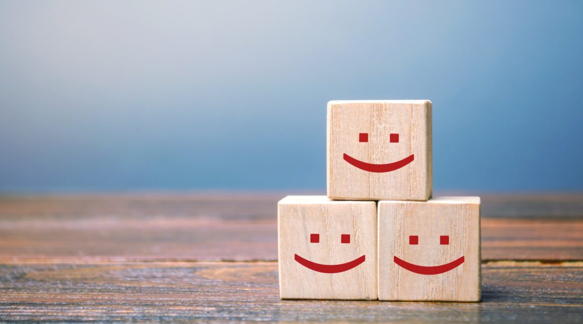 three wooden blocks on a table