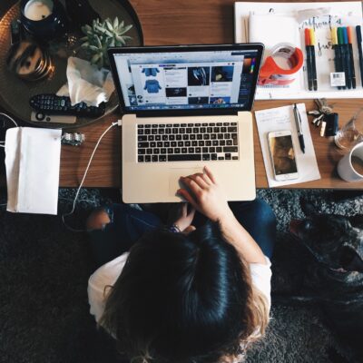 woman on laptop on coffee table