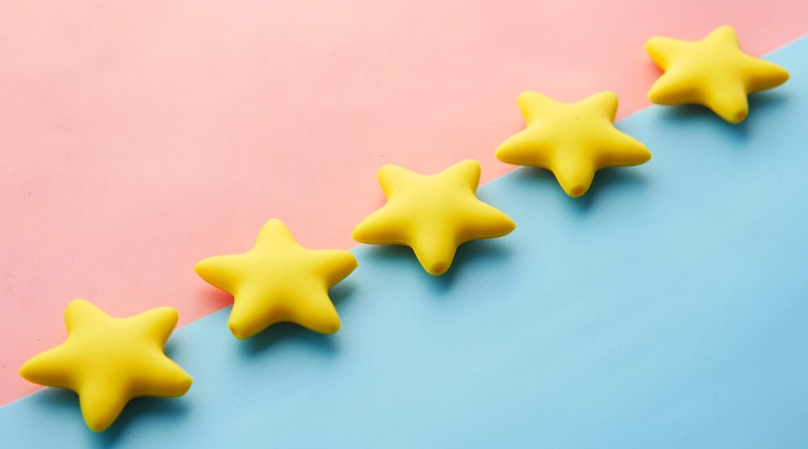 Five stars on a pink and blue background