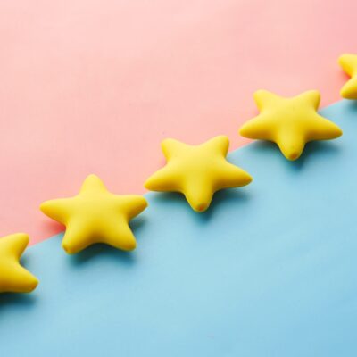 Five stars on a pink and blue background