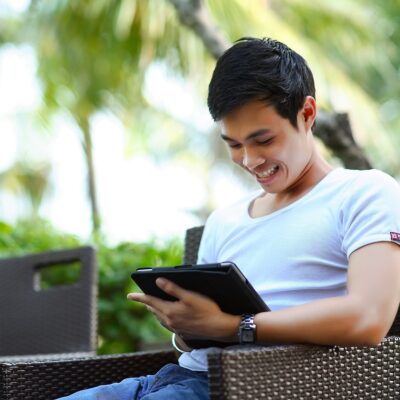 A man checking his business's Google Business Profile on a tablet